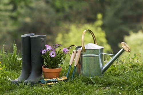 Person using keyboard to navigate a gardening services page on a laptop